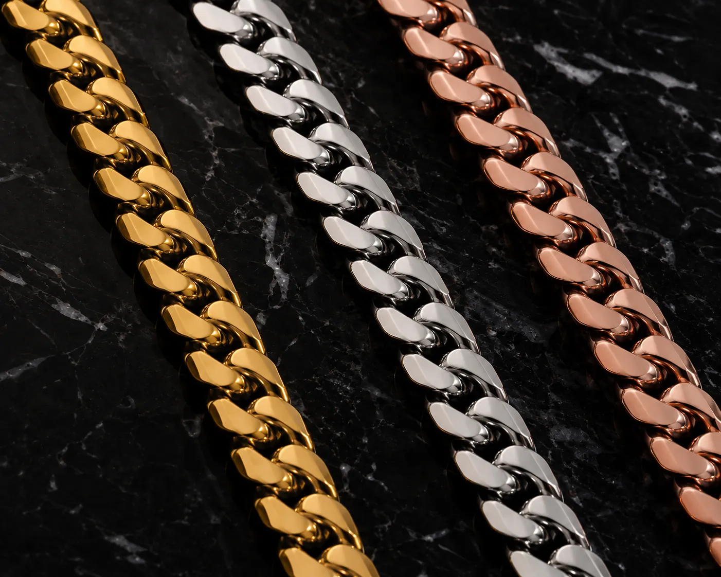 Yellow gold, white gold and rose gold Cuban link chains side by side